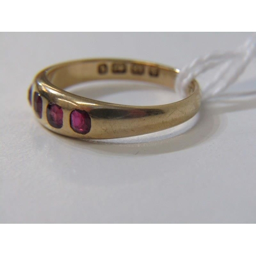 65 - RUBY RING, 18ct yellow gold ring set rubies in half eternity style, size N