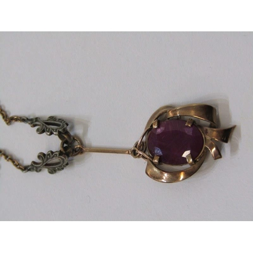 186 - ART NOUVEAU STYLE PENDANT, yellow gold pendant tests as 9ct, set with an oval ruby on a fine link go... 