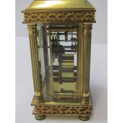 100 - CARRIAGE CLOCK, antique brass bevelled glass carriage clock with shamrock design and fluted column s... 