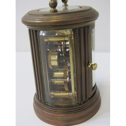 111 - MINIATURE CARRIAGE CLOCK, oval case body with alarm bell base, inscribed 