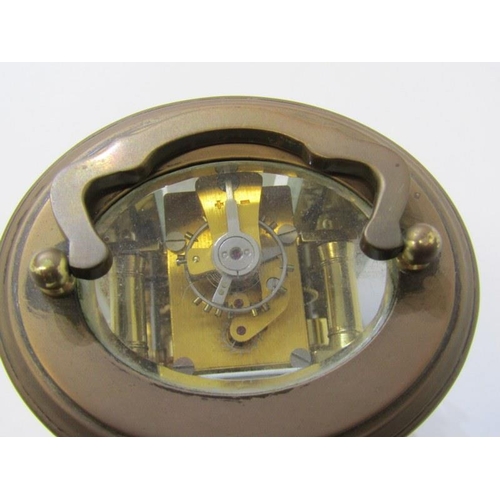 111 - MINIATURE CARRIAGE CLOCK, oval case body with alarm bell base, inscribed 