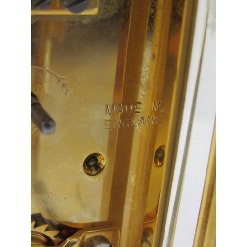 118 - CARRIAGE CLOCK, plain brass case bevelled glass carriage clock by St James with key