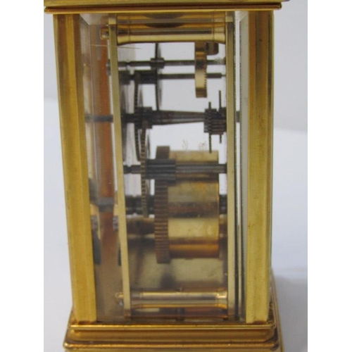 118 - CARRIAGE CLOCK, plain brass case bevelled glass carriage clock by St James with key