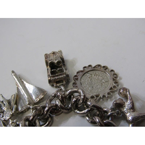 176 - SILVER CHARM BRACELET, curb link bracelet with padlock clasp, approx. 12 charms, 91.8 grams