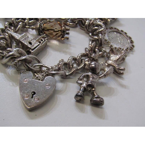 176 - SILVER CHARM BRACELET, curb link bracelet with padlock clasp, approx. 12 charms, 91.8 grams