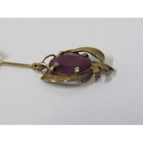 186 - ART NOUVEAU STYLE PENDANT, yellow gold pendant tests as 9ct, set with an oval ruby on a fine link go... 