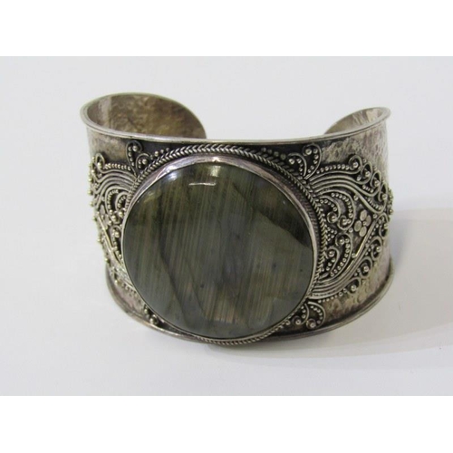 222 - LARGE SILVER STONE SET BANGLE with hammered effect decoration, over 68 grams