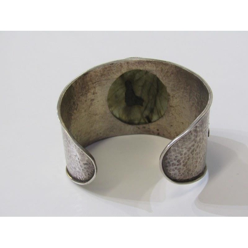 222 - LARGE SILVER STONE SET BANGLE with hammered effect decoration, over 68 grams