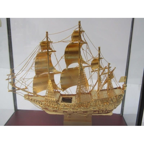 67 - MARITIME, cabinet cased gilt model of galleon 