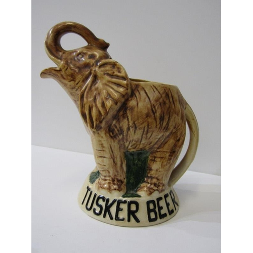 26 - ADVERTISING, 'Tusker Beer' elephant jug, Dresser-style red glazed jug and 3 other pieces