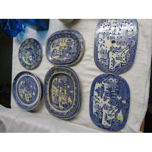 29 - BLUE TRANSFER WARE, collection of willow pattern tableware including 2 strainers and other printed t... 