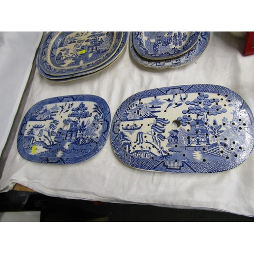 29 - BLUE TRANSFER WARE, collection of willow pattern tableware including 2 strainers and other printed t... 