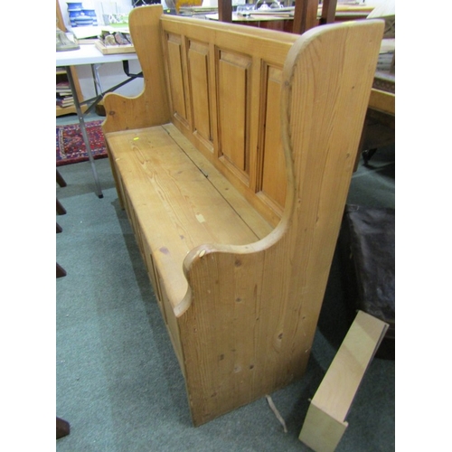 735 - PINE BENCH, pine panelled bench with rising cupboard base, 120cm length