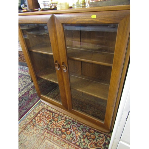 738 - ERCOL glazed twin door bookcase