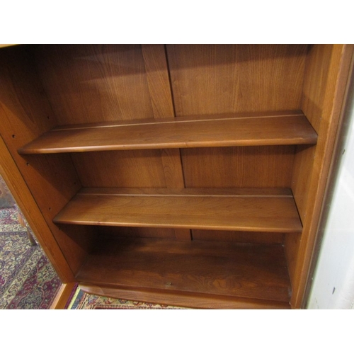 738 - ERCOL glazed twin door bookcase