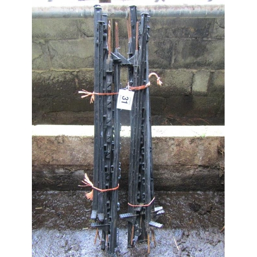 31 - A bundle of 20 black electric fence stakes