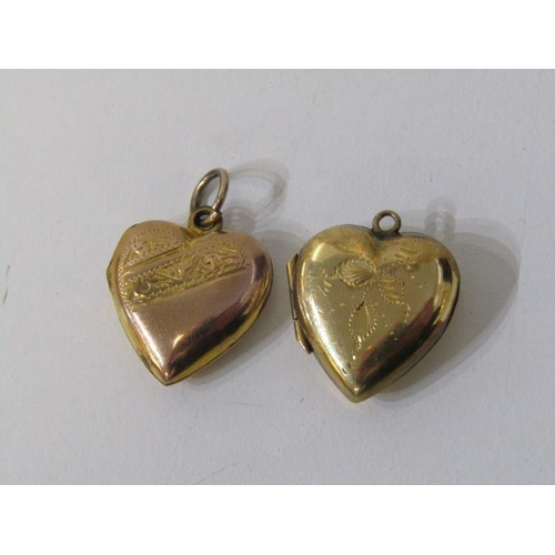 54 - HEART SHAPED PENDANTS, 2 yellow metal heart shaped pendants, with foliate engraved decoration, marke... 