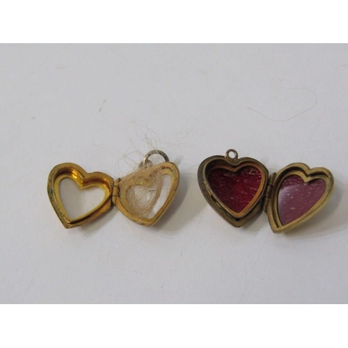 54 - HEART SHAPED PENDANTS, 2 yellow metal heart shaped pendants, with foliate engraved decoration, marke... 