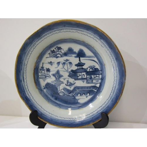 31 - ORIENTAL CERAMICS, a Canton porcelain plate and bowl decorated with buildings along a riverside, wit... 