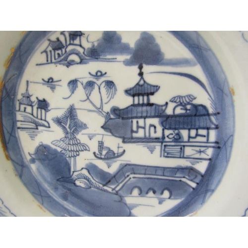 31 - ORIENTAL CERAMICS, a Canton porcelain plate and bowl decorated with buildings along a riverside, wit... 