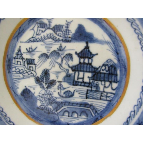 31 - ORIENTAL CERAMICS, a Canton porcelain plate and bowl decorated with buildings along a riverside, wit... 