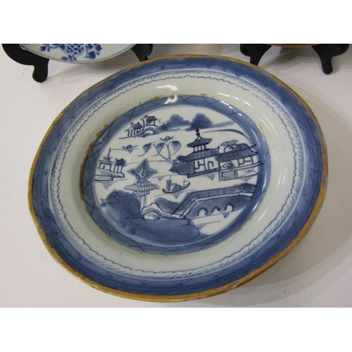 31 - ORIENTAL CERAMICS, a Canton porcelain plate and bowl decorated with buildings along a riverside, wit... 