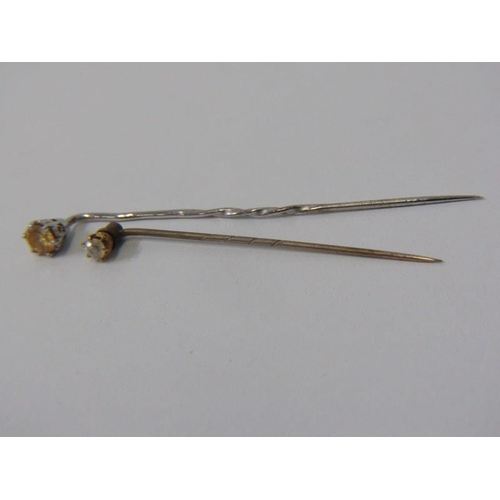 102 - DIAMOND STICK PINS, 9ct stick pin set a diamond, also a white metal stick pin, possibly platinum, se... 