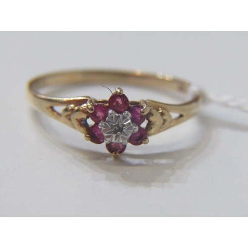 134A - RUBY AND DIAMOND CLUSTER RING, 9ct yellow gold ring set with a central diamond, surrounded by a clus... 