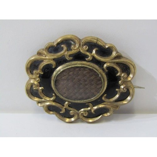 169 - VICTORIAN MOURNING BROOCH, of oval form, with black enamel and gold decoration, back tests as 9ct, 5... 