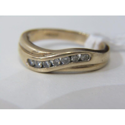 195 - CROSSOVER RING, with round briliant cut channel set diamonds, size O