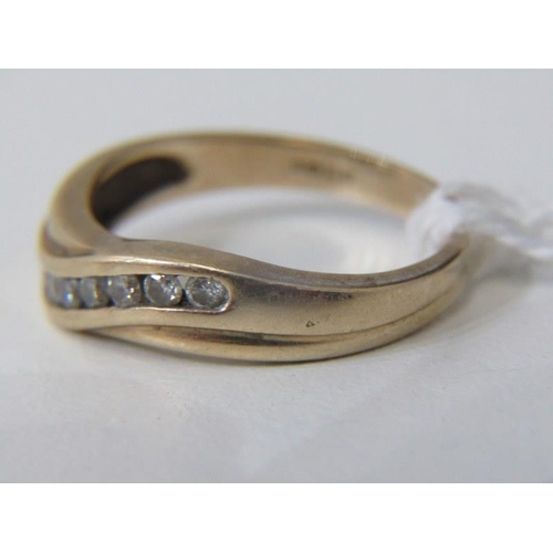 195 - CROSSOVER RING, with round briliant cut channel set diamonds, size O