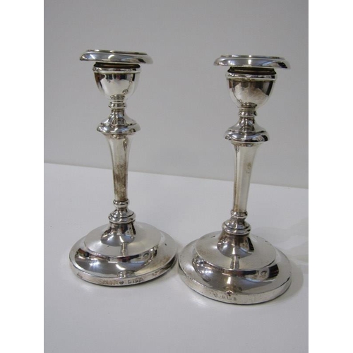 222 - 2 PAIRS OF SILVER CANDLESTICKS, a pair of Edwardian silver candlesticks on tapering support with rem... 