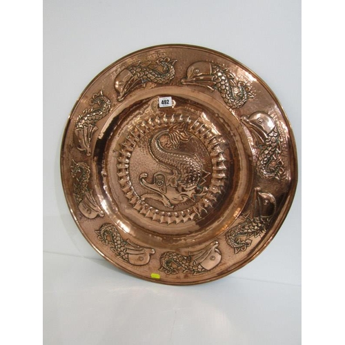 492 - NEWLYN COPPER, an impressive leaping fish design 59cm circular charger, unsigned