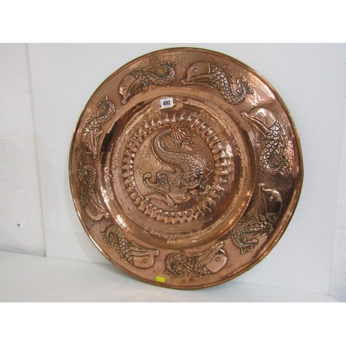 492 - NEWLYN COPPER, an impressive leaping fish design 59cm circular charger, unsigned