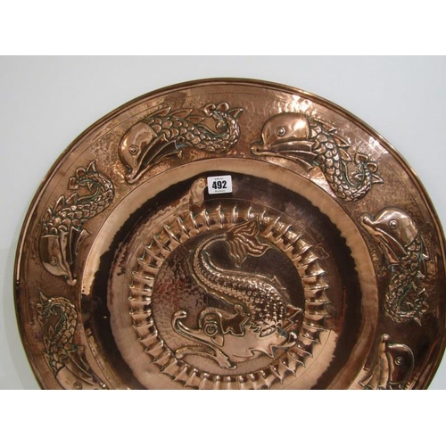 492 - NEWLYN COPPER, an impressive leaping fish design 59cm circular charger, unsigned