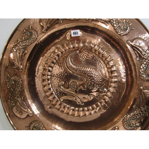 492 - NEWLYN COPPER, an impressive leaping fish design 59cm circular charger, unsigned