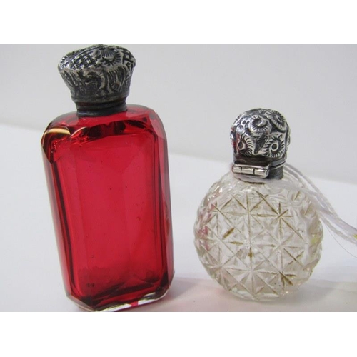 155 - SILVER TOPPED SCENT BOTTLES, a cranberry glass scent bottle with silver top together with another si... 