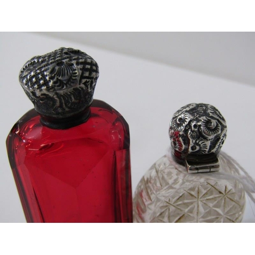 155 - SILVER TOPPED SCENT BOTTLES, a cranberry glass scent bottle with silver top together with another si... 