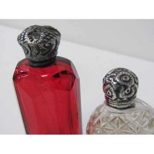 155 - SILVER TOPPED SCENT BOTTLES, a cranberry glass scent bottle with silver top together with another si... 