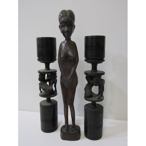 16 - ETHNIC ART, 4 assorted carved African busts, pair of turned candle sticks and a figure of a woman