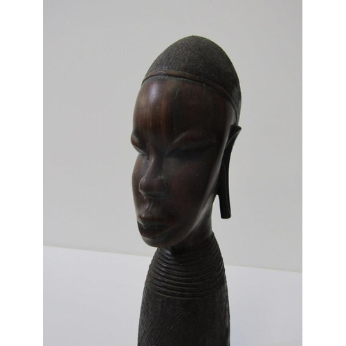 16 - ETHNIC ART, 4 assorted carved African busts, pair of turned candle sticks and a figure of a woman