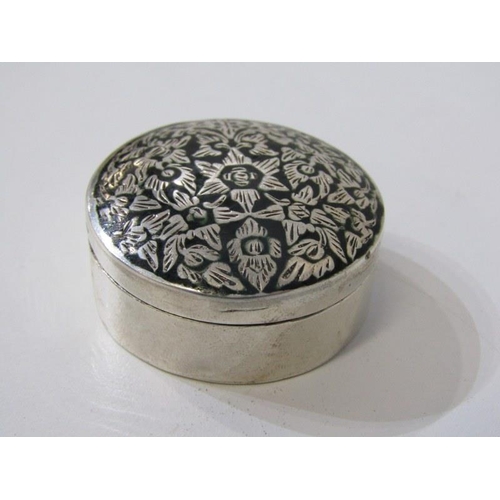 173 - SILVER, a circular silver lidded box with black enamel & foliate decorated lid, also a silver vesta ... 