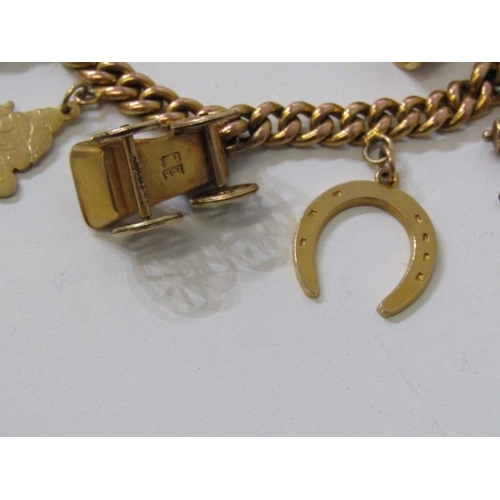 184 - GOLD CHARM BRACELET, 9ct gold curb link watch chain set 1910 half sovereign together with 9 further ... 