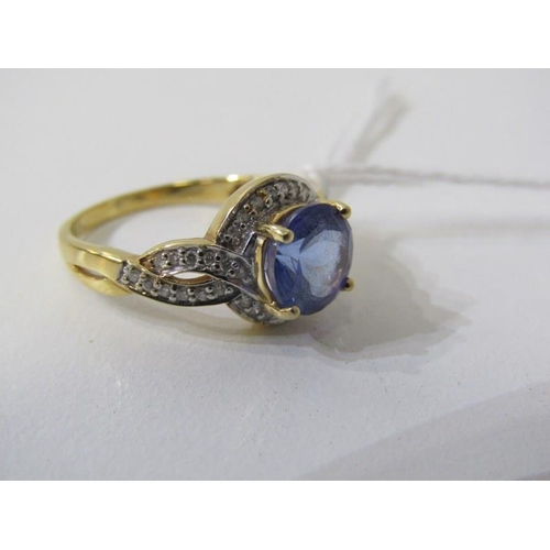 191 - TANZANITE & DIAMOND RING, 18ct yellow gold ring, set a large round tanzanite within a cluster of dia... 