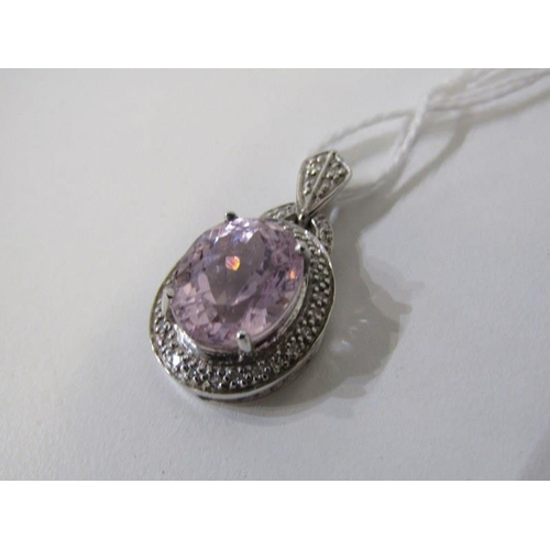 195 - PINK TOPAZ PENDANT, 9ct white gold pendant, set a large oval pink topaz, 12mm spread, set within a d... 