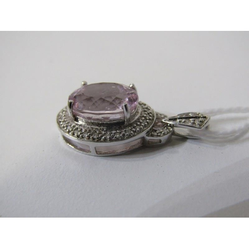 195 - PINK TOPAZ PENDANT, 9ct white gold pendant, set a large oval pink topaz, 12mm spread, set within a d... 