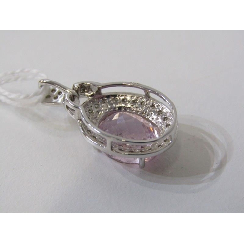 195 - PINK TOPAZ PENDANT, 9ct white gold pendant, set a large oval pink topaz, 12mm spread, set within a d... 