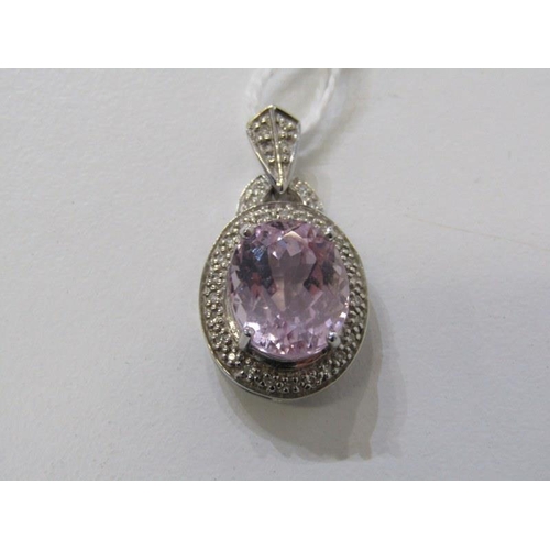 195 - PINK TOPAZ PENDANT, 9ct white gold pendant, set a large oval pink topaz, 12mm spread, set within a d... 