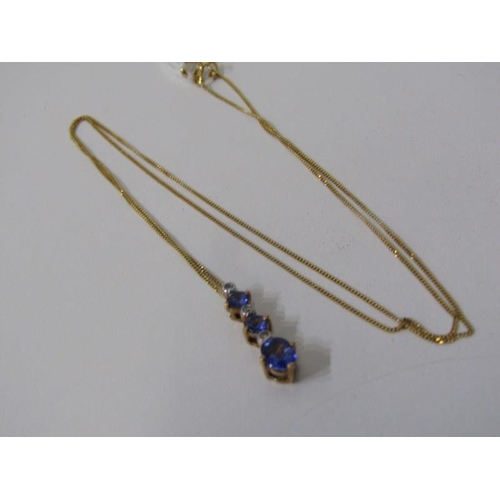 199 - TANZANITE & DIAMOND PENDANT, 9ct yellow gold pendant set graduated tanzanites and diamonds on 18