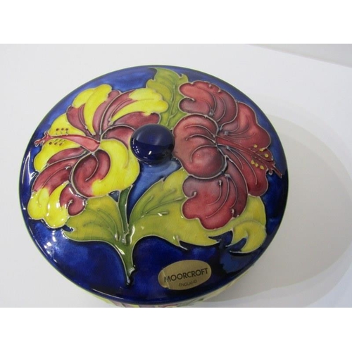 2 - MOORCROFT, Moorcroft shallow lidded dish, decorated hibiscus pattern on a blue ground, 70cm diameter